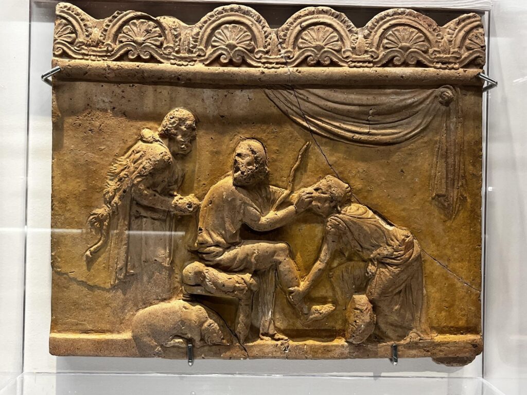Euriclea riconosce Ulisse dalla cicatrice mentre gli lava i piedi nella reggia di Itaca.